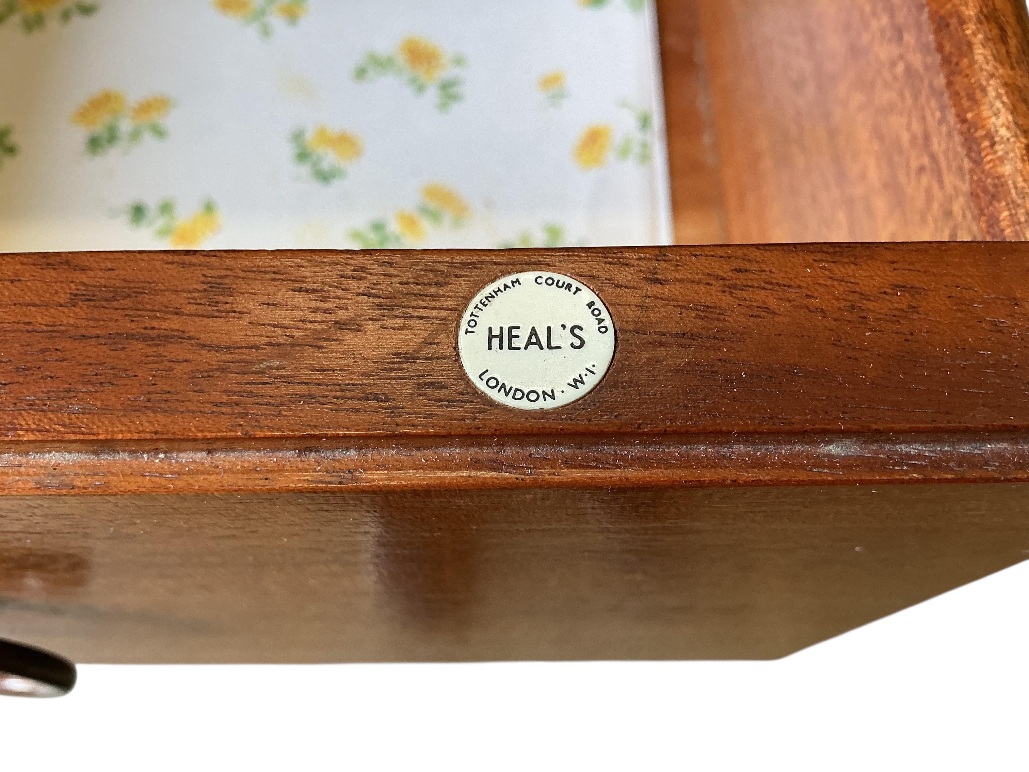 A Loughborough For Heals brass inlaid teak four piece bedroom suite comprising: triple wardrobe, width 120cm, depth 54cm, height 176cm, two chests of drawers and a toilet mirror